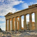 Young Asian Girl In Business Suit Holding Calculator And Working On Laptop