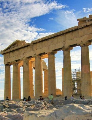 Young Asian Girl In Business Suit Holding Calculator And Working On Laptop