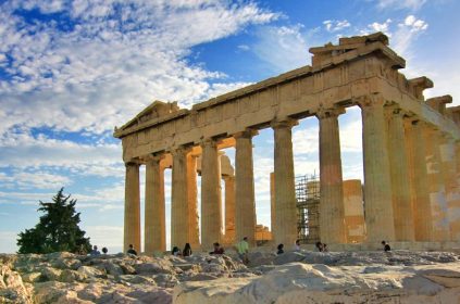 Young Asian Girl In Business Suit Holding Calculator And Working On Laptop