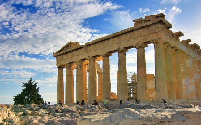 Young Asian Girl In Business Suit Holding Calculator And Working On Laptop