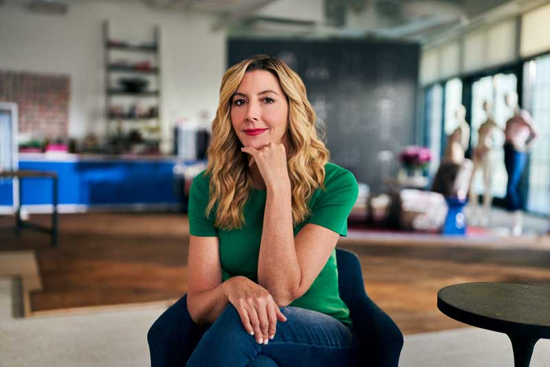 Spanx CEO Sara Blakely Sitting On Chair In Her Office