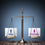 Perfectly Balanced Scale With Paper Sign Showing Men Symbol On One Side And Women On the Other