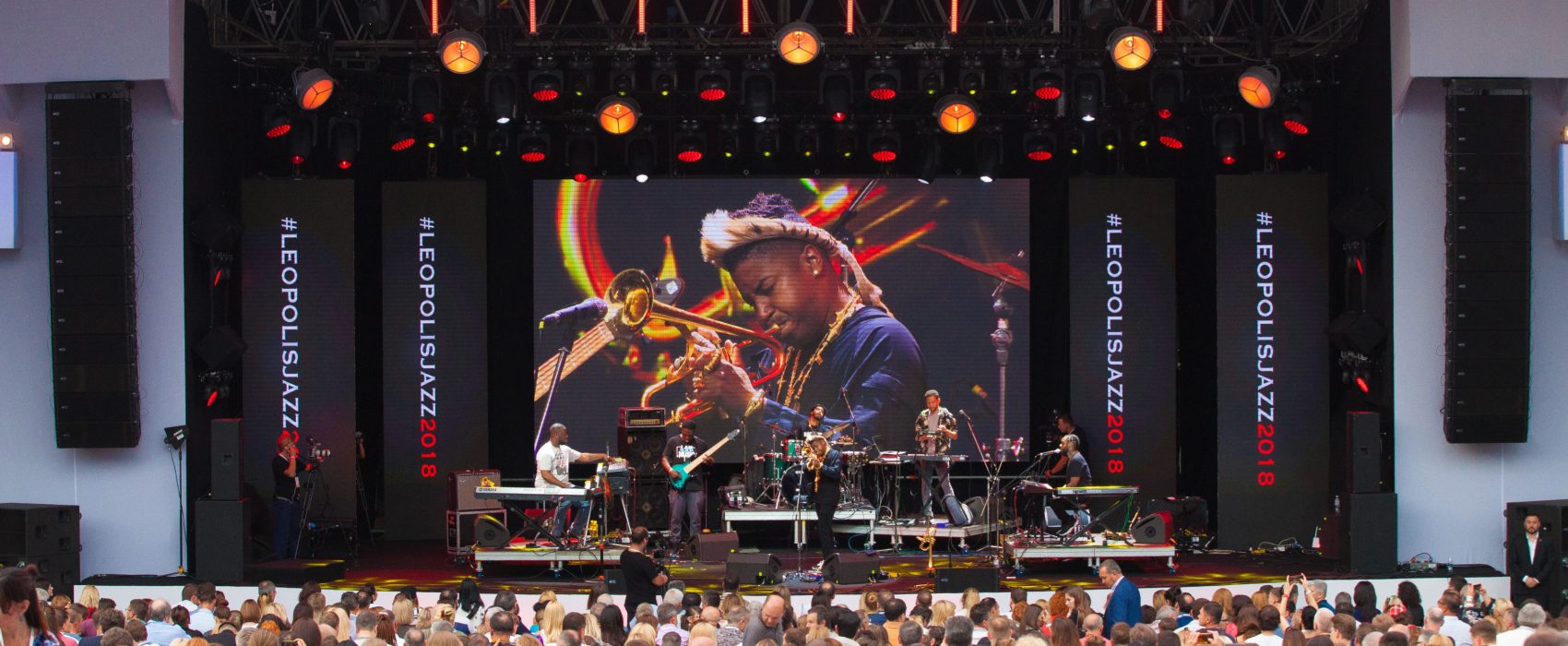 Jazz Concert With Audience Looking At Performer On Stage
