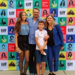 John Vellinga With His Wife Katherine And Children In Front Of Tiff Poster