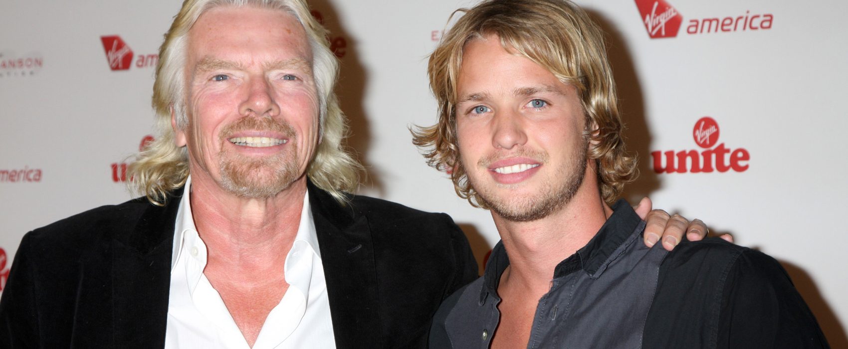 Richard Branson Smiling For Photo With Arm Around His Son Photo: iStock