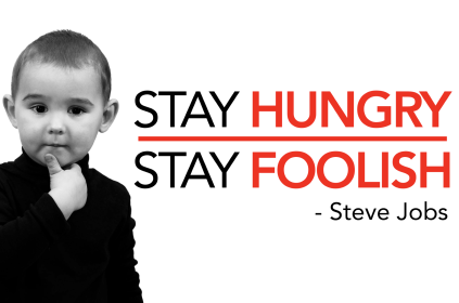 Black And White Photo Of Young Boy Steve Jobs Look-A-Like With Hand Under Chin In Black Turtle Neck Shirt