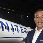 Smiling Oscar Munoz With UNITED Airlines Jet In The Background
