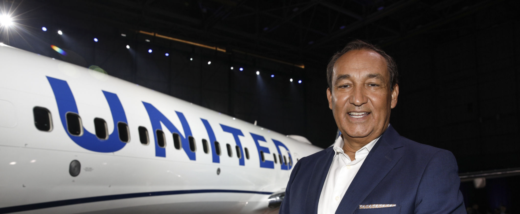 Smiling Oscar Munoz With UNITED Airlines Jet In The Background