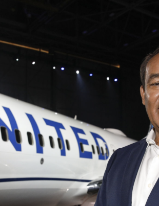 Smiling Oscar Munoz With UNITED Airlines Jet In The Background