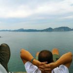 Person Relaxing On His Back Overlooking Atlantic Ocean On The Spanish Coast