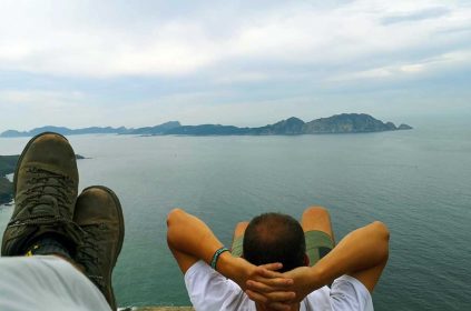 Person Relaxing On His Back Overlooking Atlantic Ocean On The Spanish Coast