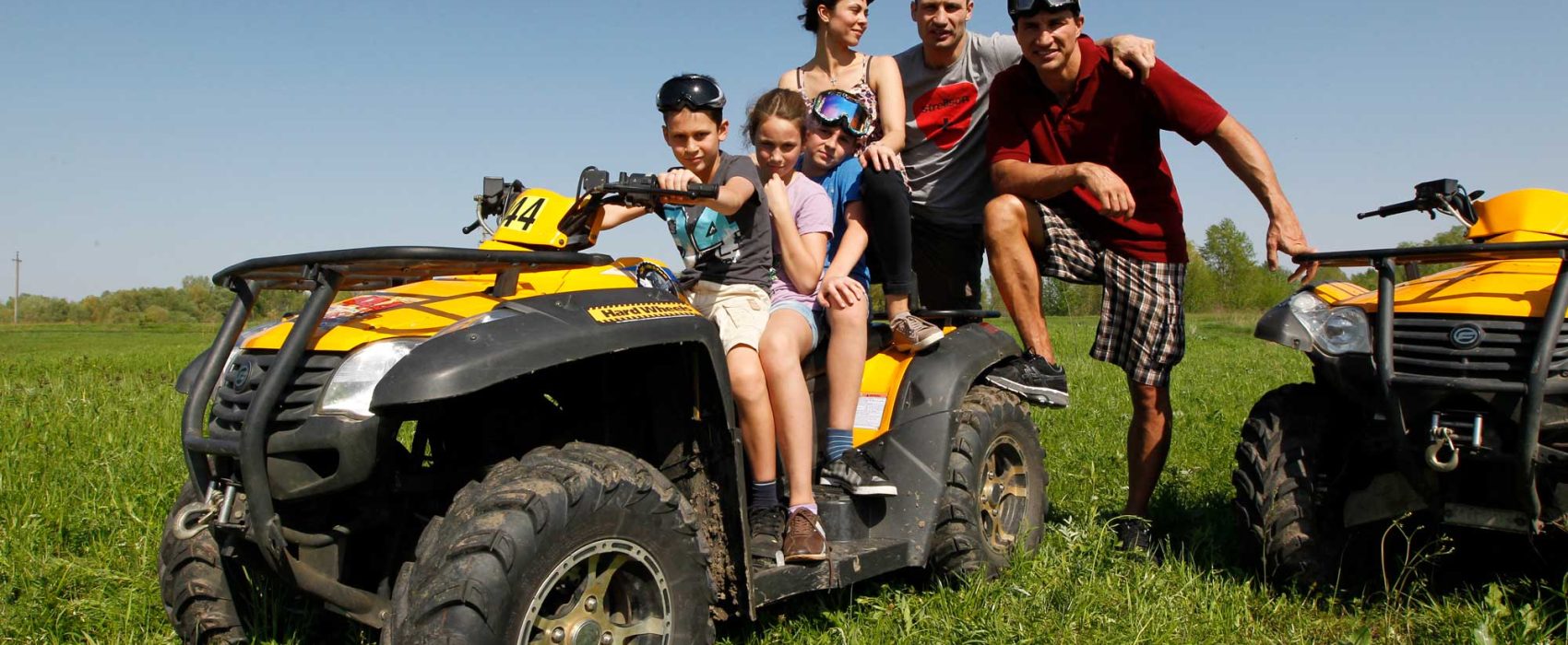 Vitali Klitschko With Family And Brother Wladimir Klitchko Sitting On ATV