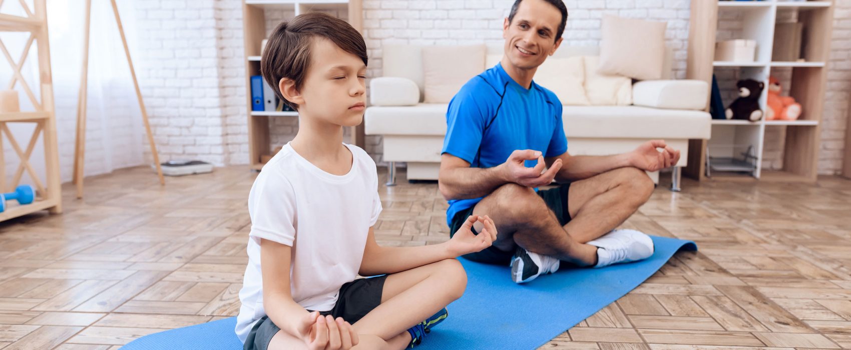 Father And Son Performing Yoga Together