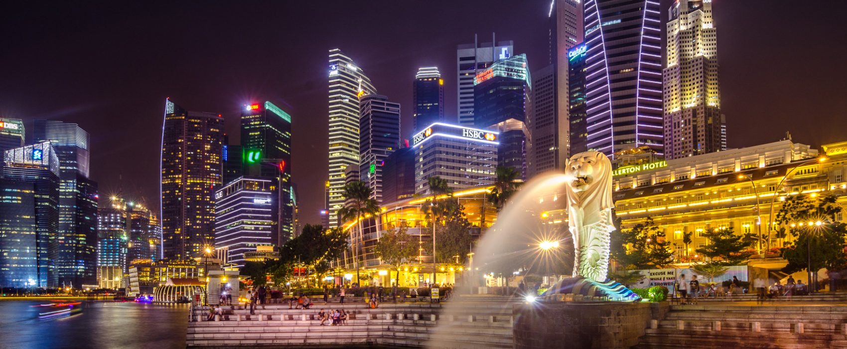 Fullerton Bay Hotel At Night On The Banks Of Marina Bay